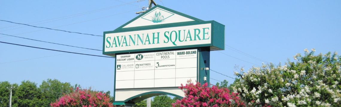 A photo of an outdoor sign for the Savannah Square Shopping Center.